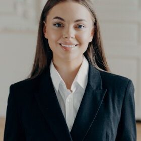 young-smiling-bussiness-woman-looking-at-camera-an-2021-09-02-23-47-32-utc.jpg